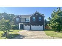 Traditional two-story home with a two-car garage and manicured front lawn at 1116 Powder, Fuquay Varina, NC 27526