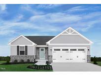 Charming single-story home featuring stone accents, light gray siding, manicured lawn and an attached two-car garage at 188 South Breeze Way, Fuquay Varina, NC 27526