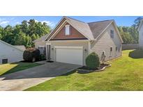 Charming one-story home featuring a two-car garage, well-maintained lawn, and classic siding at 39 Mcguire Ln, Clayton, NC 27527