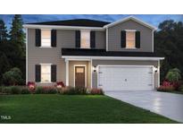 Charming two-story home featuring a two-car garage and beautiful landscaping at 722 White Birch Ln, Angier, NC 27501