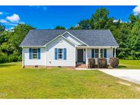 Charming single-story home with blue shutters, well-maintained lawn, and inviting curb appeal at 101 Kristina Dr, Selma, NC 27576
