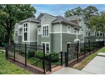 Charming multi-level condo features a fenced yard and tasteful, neutral siding at 1111 Parkridge Ln # 103, Raleigh, NC 27605