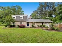 Charming two-story brick home with a well-manicured lawn and established landscaping at 2805 Friendship Rd, Durham, NC 27705