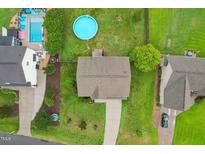 Aerial view of a single-Gathering home with a pool and well-maintained yard at 50 Consella Way, Franklinton, NC 27525