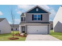 Charming two-story home with gray siding, a two-car garage, and a well-manicured lawn at 51 Crow Field St, Roxboro, NC 27574