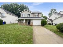Charming two-story home with a well-maintained lawn and inviting curb appeal at 1216 Briarwood Dr, Mebane, NC 27302