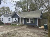 Charming single-story home with a welcoming front porch and classic architectural details at 2503 Chapel Hill Rd, Durham, NC 27707