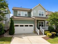 Charming two-story home featuring a two-car garage, landscaped yard and inviting front porch at 78 Salt Cedar Ln, Chapel Hill, NC 27516