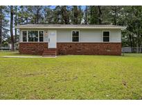 Charming single-story home with brick facade and well-maintained lawn at 111 S Gaylee Lake Dr, Wendell, NC 27591