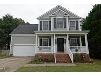 Charming two-story home with a welcoming front porch and well-maintained landscaping at 114 Calebra Way # 114, Cary, NC 27519