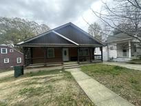 Charming home with a welcoming front porch and a well-maintained walkway leading to the entrance at 2509 Chapel Hill Rd, Durham, NC 27707