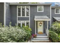 Charming two-story home with blue siding, well-maintained landscaping, and inviting front porch at 120 Jo Anne Cir, Cary, NC 27513