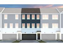 Stylish townhome featuring navy blue accents, a two-car garage, and charming curb appeal at 1517 Tamarisk Ln, Durham, NC 27703