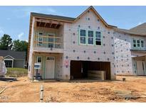 New construction of a two-story home with visible framing and large window openings at 256 Meadowbark Bnd # 45, Garner, NC 27529