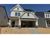 New two-story home featuring a two-car garage and craftsman-style details at 264 Meadowbark Bnd # 43, Garner, NC 27529