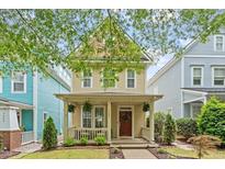 Charming two-story home featuring a welcoming front porch and beautifully maintained landscaping at 4605 All Points View Way, Raleigh, NC 27614