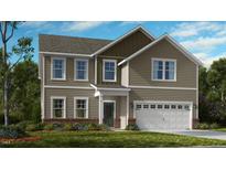 Charming two-story home with a manicured lawn and an attached two-car garage at 535 Claftin St, Sanford, NC 27330