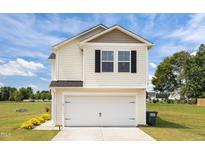 Charming two-story home with a two-car garage and well-maintained lawn and landscaping at 4097 Cordiality Church Rd, Nashville, NC 27856