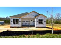 New construction home featuring a classic design and a spacious, undeveloped yard at 90 Brookhaven Dr, Spring Hope, NC 27882