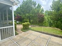 This backyard patio features a walkway to an enormous yard at 1004 Bridlemine Dr, Fuquay Varina, NC 27526
