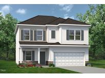 Charming two-story home with a two-car garage, stone accents, and a beautifully landscaped yard at 115 Mildred Place, Broadway, NC 27505