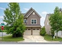Charming two-story home with a two-car garage and well-maintained lawn at 2001 October Dr, Durham, NC 27703