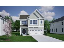 Charming two-story home with gray siding, white trim, a two-car garage, and a well-manicured lawn at 252 Meadowbark Bnd # 46, Garner, NC 27529