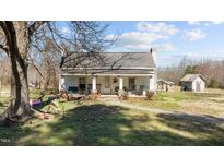 Charming single-story home with a welcoming front porch and classic architectural details at 2710 Morton Pulliam Rd, Roxboro, NC 27574