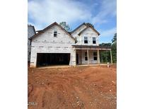 A partially built two-story home displays a covered porch, visible framing, and an attached two-car garage at 432 Golden Dragonfly St, Wake Forest, NC 27587
