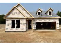 Exterior view of a home under construction with a two-car garage and covered entrance at 455 Beacon Hill Rd # 28, Lillington, NC 27546