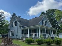 Charming two-story home with a welcoming porch and ample yard space at 509 W Rose St, Sanford, NC 27330