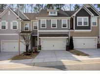 Charming townhouse with attached garage, neutral colors, and well-maintained front yard at 629 Newlyn Dr, Raleigh, NC 27606