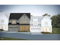 Charming new construction townhomes with traditional architectural elements, manicured landscaping and attached garages at 1011 Coldspring Circle, Durham, NC 27705