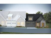 New townhome rendering showcasing two-story elevations with attached garages and brick accents at 1027 Coldspring Circle, Durham, NC 27705