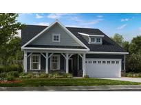 Charming craftsman-style home featuring a well-manicured lawn and an attached two-car garage at 1124 Sun Springs Rd, Wake Forest, NC 27587