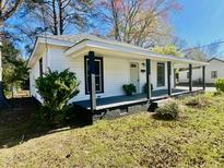 Charming single-story home with a covered front porch and freshly painted white siding at 602 Dexter St, Rocky Mount, NC 27803