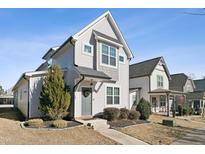 Charming two-story home features a well-maintained front yard and inviting entryway, providing great curb appeal at 107 York Dr, Oxford, NC 27565