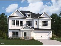 Charming two-story home with white siding, a two-car garage, and professional landscaping at 127 S Harvest Ridge Way # Homesite 321, Wilson's Mills, NC 27520