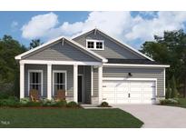 Charming home featuring a welcoming front porch, a two-car garage, and a beautifully landscaped lawn at 139 W Crescent Mills Blvd # Homesite 235, Wilson's Mills, NC 27520