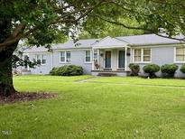 Charming duplex with well-maintained lawn and landscaping offers great curb appeal and comfortable living at 1500 Brent Ct # 9B, Burlington, NC 27215