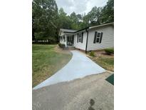Inviting single-story home featuring a well-maintained lawn and a freshly painted walkway at 195 Windsong Ln, Youngsville, NC 27596