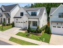 Charming two-story home with manicured lawn, and a two car garage at 245 Tumbling River Dr, Wendell, NC 27591