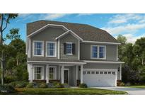 Charming two-story home featuring gray siding, a two-car garage, and a well-maintained front lawn at 527 Claftin St, Sanford, NC 27330