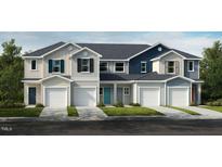 Charming townhouse featuring varied siding styles, inviting entrances, and attached single-car garages at 1985 Rabbitbrush St, Durham, NC 27704