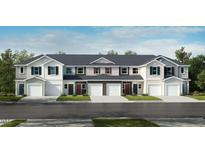 New townhomes feature white and gray facades, single-car garages, and professionally landscaped lawns at 2003 Rabbitbrush St, Durham, NC 27704