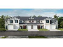 Charming townhome featuring a landscaped front yard and convenient garage entry at 2009 Rabbitbrush St, Durham, NC 27704