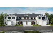 New townhome construction with diverse color schemes, garages, and manicured lawns at 2013 Rabbitbrush St, Durham, NC 27704