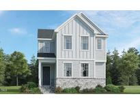Charming two-story home with gray siding, stone foundation, and well-manicured landscaping at 217 Leland Crest Dr, Apex, NC 27539