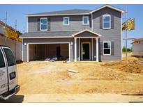Two-story home with gray siding and a two car garage under construction at 693 White Birch Ln, Angier, NC 27501