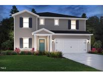Charming two-story home with a manicured lawn and a two-car garage, showcasing a welcoming exterior at 693 White Birch Ln, Angier, NC 27501